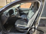 the interior of a car with the driver ' s seat folded down