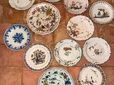 a lot of plates that are on the floor