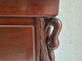 a close up of a wooden cabinet with a handle on it