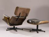 an image of a chair and ottoman in a studio setting