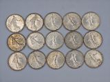 a close up of a bunch of coins sitting on top of a table