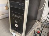 a computer that is sitting on the floor in the room
