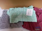 a box of clothes sitting on a table with a price tag on it