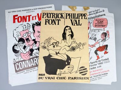 two posters of political cartoons are on a table