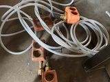a bunch of hoses on the floor next to a fire hydrant