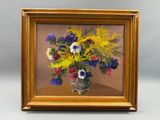 une peinture de fleurs dans un vase sur une table