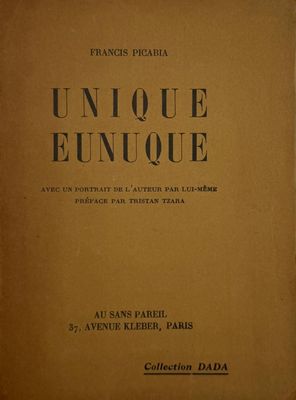 an old book with black writing on it sitting on a table
