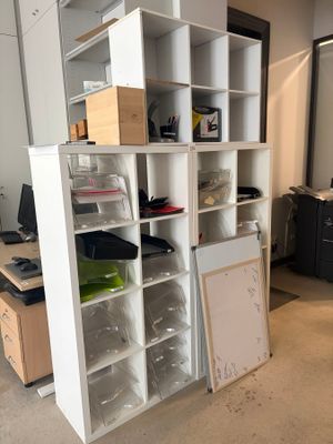 a room with a bunch of boxes on the shelves