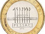 a close up of a coin with a picture of four spears on it