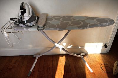 a ironing board and a shoe on a ironing board