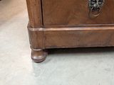 a small wooden cabinet with a drawer on top of it