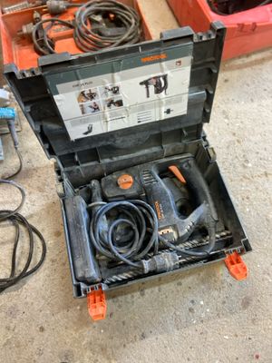 a tool box with tools in it sitting on the floor