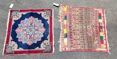 two oriental rugs on the ground, one is red and the other is blue