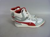 white and red puma sneakers on a white surface