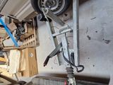 a car that is sitting on a stand in the garage