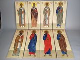 six wooden icons of saints in different colors and sizes