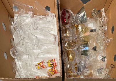 two boxes filled with different types of items in them