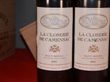 three bottles of wine sitting on a table next to each other