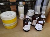 many bottles of different types of skin care products on a table