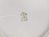 a white plate with a picture of a dog on it