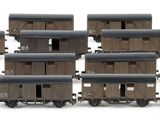 a lot of small wooden train cars on a white surface