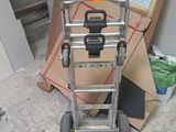 a hand truck that is sitting in the middle of a room