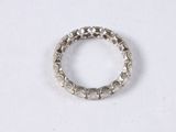 a close up of a silver ring on a white surface