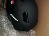 the helmet is sitting in a box on the floor