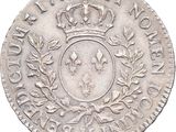an old silver coin with a crown on top of it