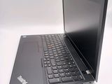 a black laptop with a black keyboard on a white surface