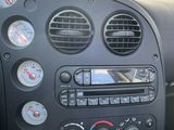 a dashboard of a car with various gauges and gauges