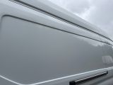 a white van that is parked in the parking lot