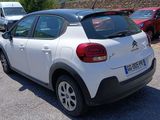 a white car that is parked in a parking lot