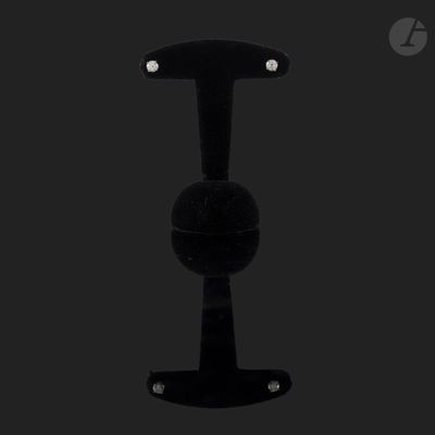 a close up of a black object on a black surface