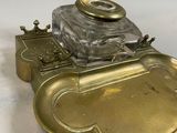 an image of a brass and glass inkwell with a crown on top