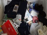 a pile of items that is sitting on a bed