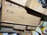boxes are stacked on top of each other in a cluttered room