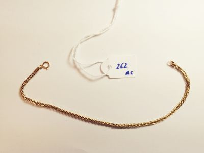a gold chain with a tag attached to it