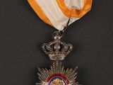 a close up of a medal with a ribbon around it