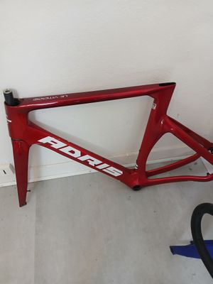 a red bike leaning against a wall in a room