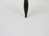 a black vase with a black handle on a white table