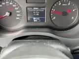 a close up of a car dashboard with a speedometer and gauges