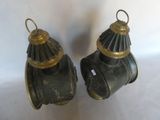 pair of antique brass fire hydrants on a white background
