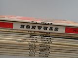 several books stacked on top of each other on a table