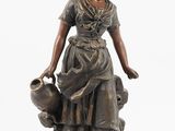 bronze statue of a woman holding a jug and a dog