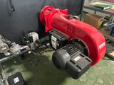 a red machine that is sitting in a room
