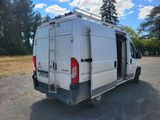 a white van that is parked in the parking lot