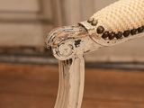 a close up of a chair with a rope on it