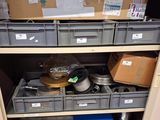 many boxes and containers on the shelves in the closet