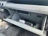 a car dashboard with a magazine holder in the center
